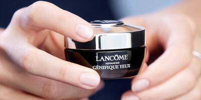 Woman applying Advanced Genifique Light Pearl Youth Activating Eye & Lash Concentrate doubles