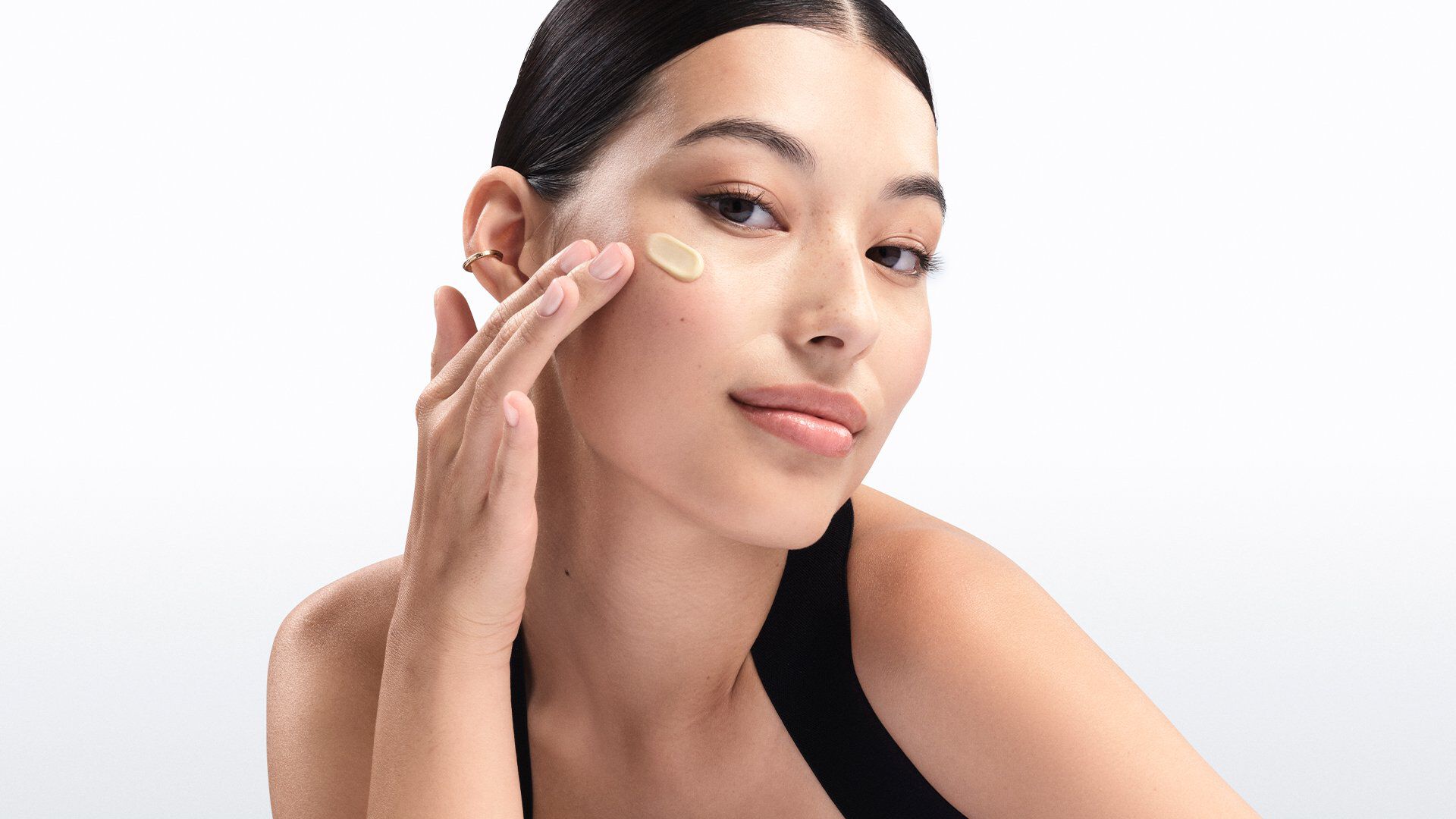 Woman with hydrated skin, demonstrating the benefits of skincare for dry and sensitive skin
