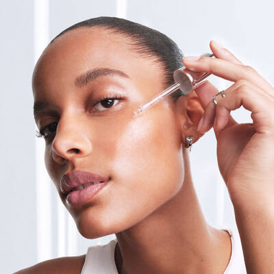 A woman performing her morning anti-aging Lancome skincare routine