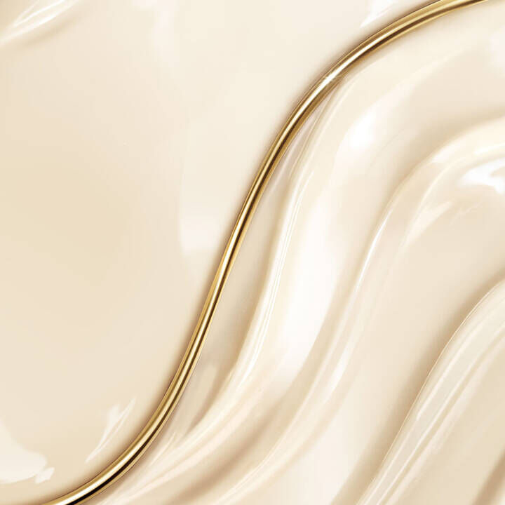 Texture and close-up of the Lancome Absolue The Eye Cream product, showing its rich and creamy consistency.