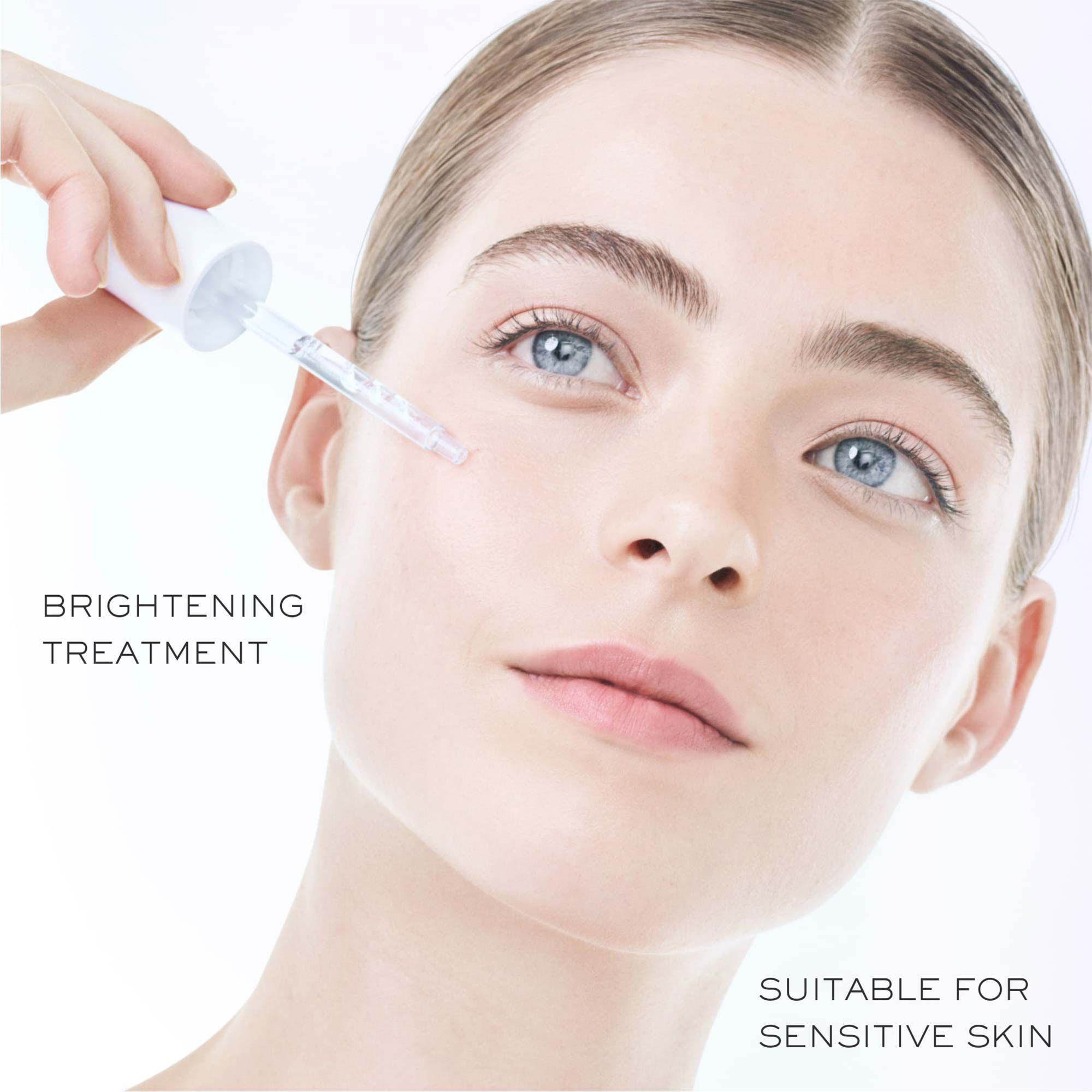 Model applying Lancome Clarifique Pro-Solution Serum suitable for sensitive skin.