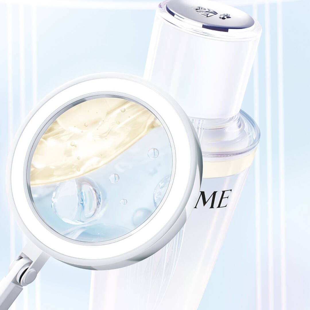 Lancome Clarifique Double Treatment Essence bi-phase close-up - Highlighting exfoliating acids and hydrating oils in the innovative formula.