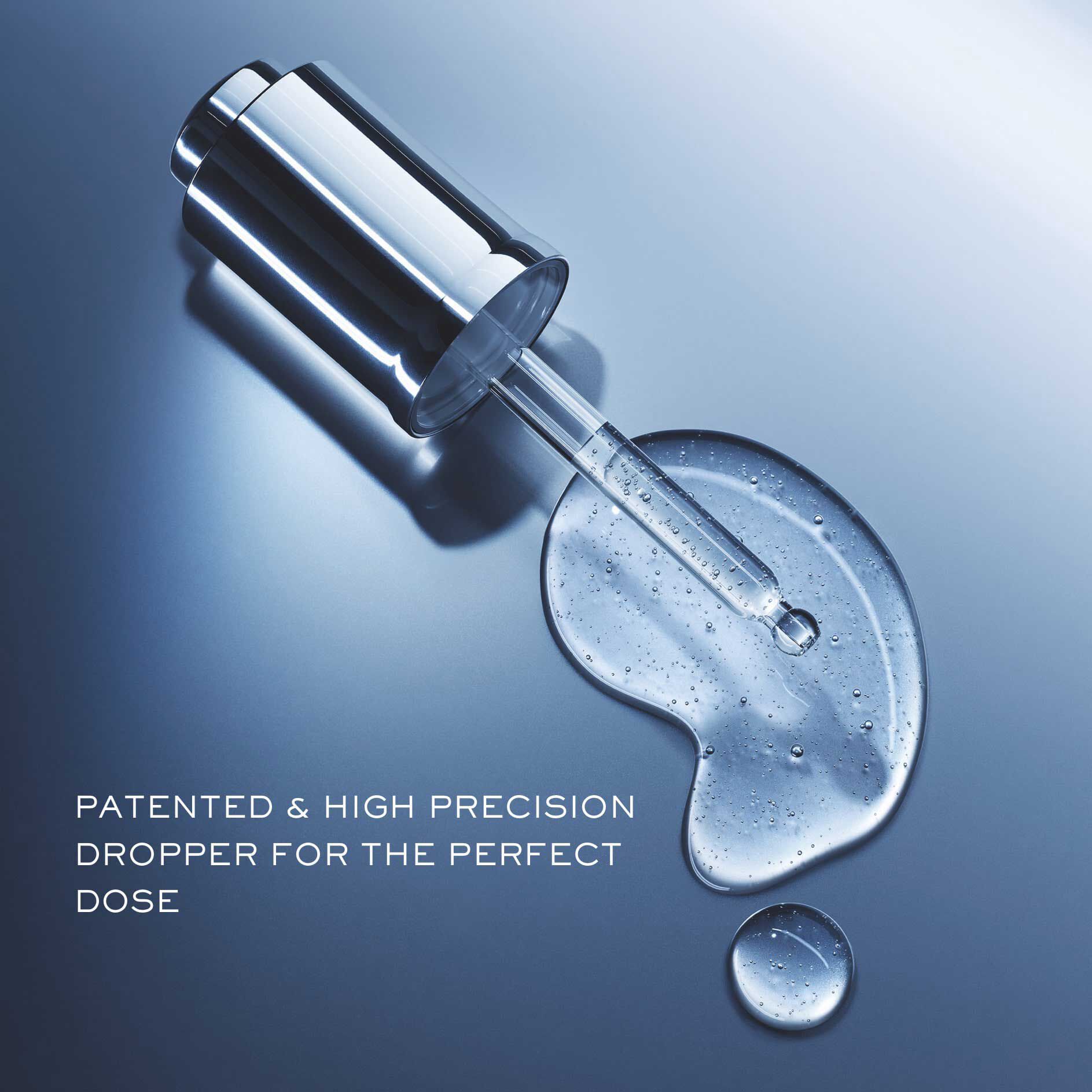 Lancome Advanced Genifique serum dropper with precise droplet emphasizing patented dosage accuracy.