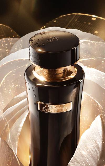 Lancome Absolue L'Extrait The Elixir Lotion - surrounded by luminous petals, showcasing its premium skincare innovation for hydration and radiance.