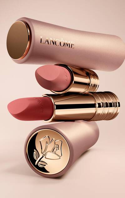 Lancome L'Absolu Rouge Intimatte lipsticks in various shades, stacked to highlight the luxurious rose gold packaging